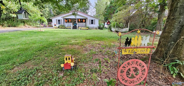 exterior space featuring a front yard and covered porch