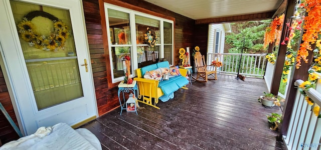 wooden terrace with a porch