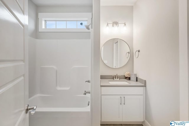 bathroom featuring vanity and bathtub / shower combination