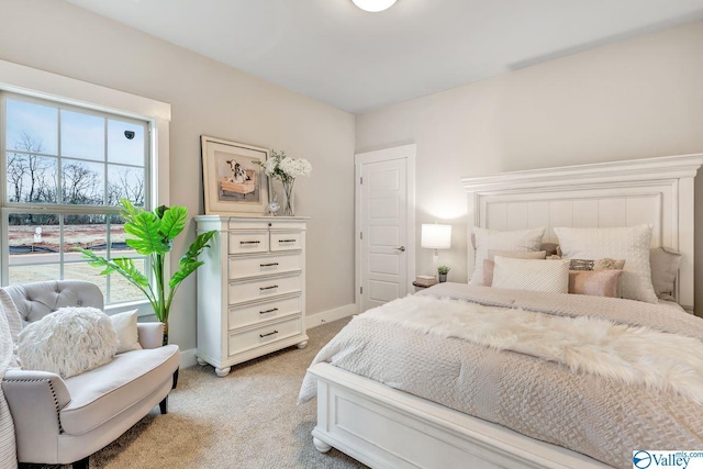 bedroom featuring light colored carpet