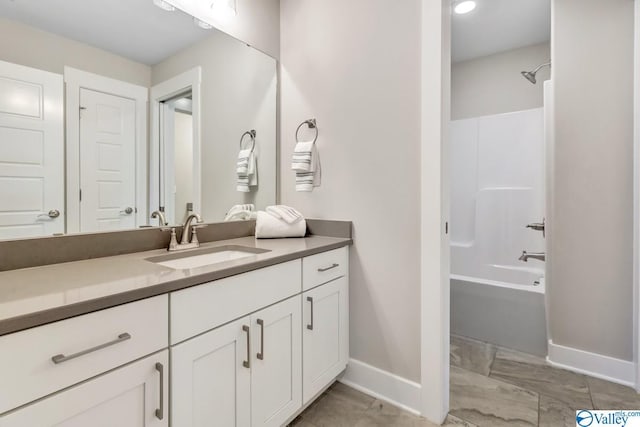 bathroom with vanity and washtub / shower combination