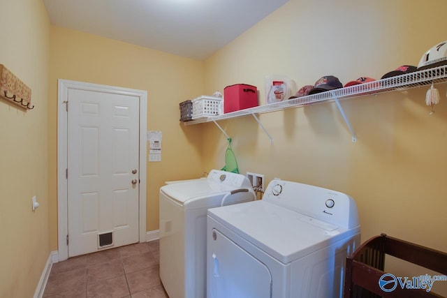 2701 Arbor Oak Dr SE, Owens Cross Roads, AL 35763 - washroom featuring separate washer and dryer, baseboards, and light tile patterned floors