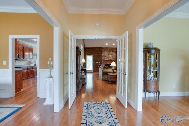 2701 Arbor Oak Dr SE, Owens Cross Roads, AL 35763 - hall featuring french doors, light wood finished floors, and ornamental molding