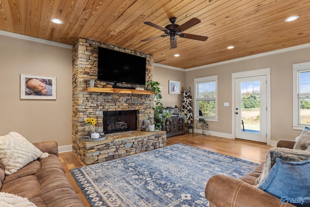 living room featuring a fireplace, wood finished floors, ceiling fan, and wood ceiling