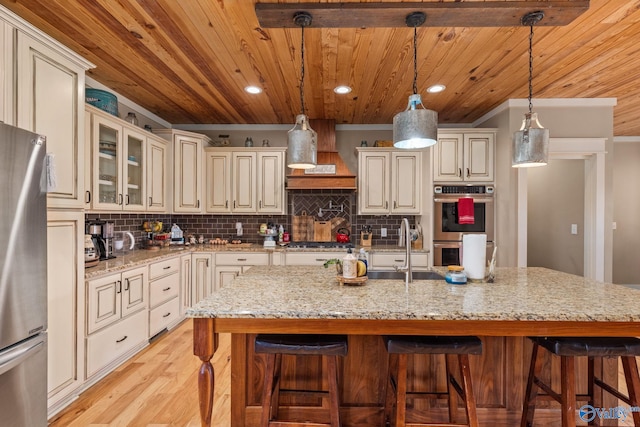 kitchen featuring tasteful backsplash, wood ceiling, and appliances with stainless steel finishes