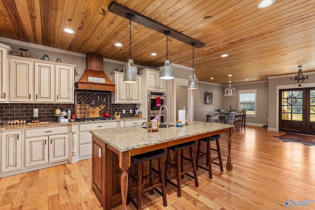 kitchen with custom range hood, crown molding, backsplash, and appliances with stainless steel finishes