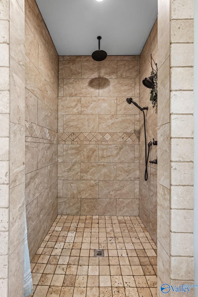 full bath with tiled shower
