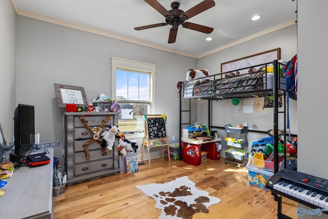 bedroom with recessed lighting, ornamental molding, ceiling fan, and wood finished floors