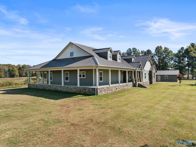 farmhouse-style home with metal roof, a standing seam roof, and a front yard