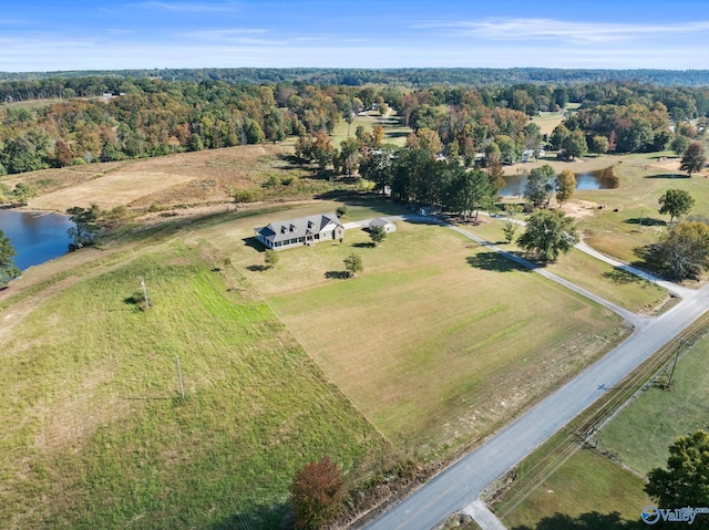 bird's eye view featuring a water view and a view of trees