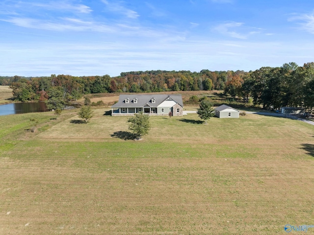 birds eye view of property featuring a wooded view