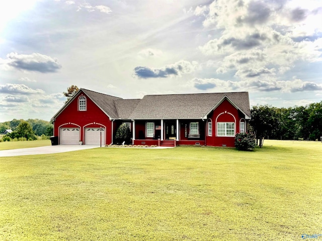 view of front facade featuring covered porch, a front yard, and a garage