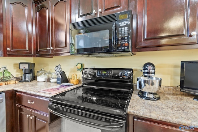 kitchen with dark brown cabinets and black appliances