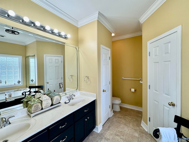 bathroom featuring ornamental molding, vanity, and toilet