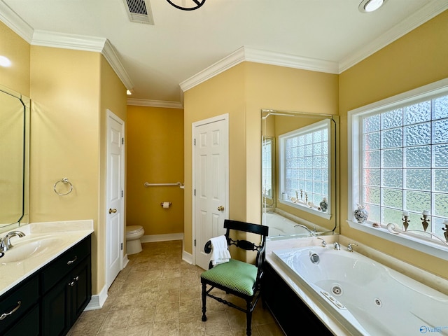 bathroom with a tub to relax in, vanity, toilet, and ornamental molding