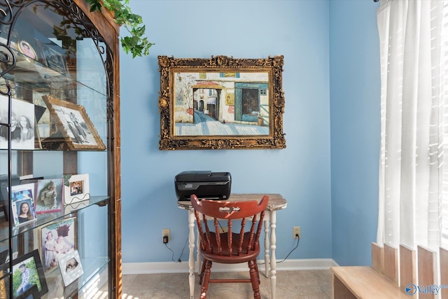 living area featuring baseboards