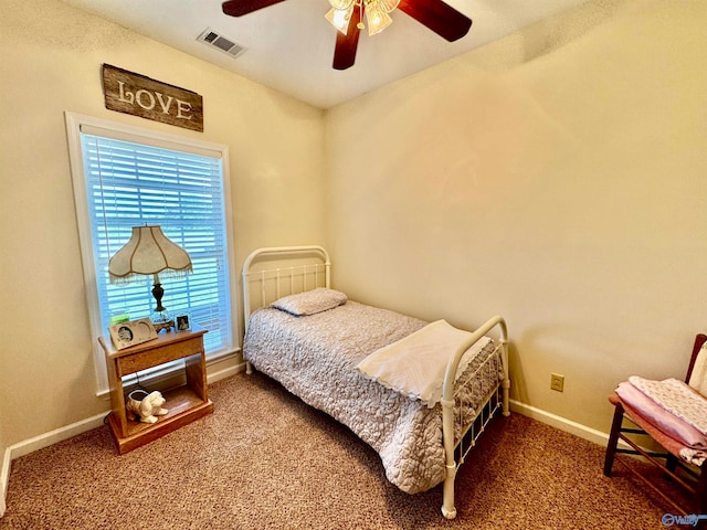 bedroom with dark carpet and ceiling fan