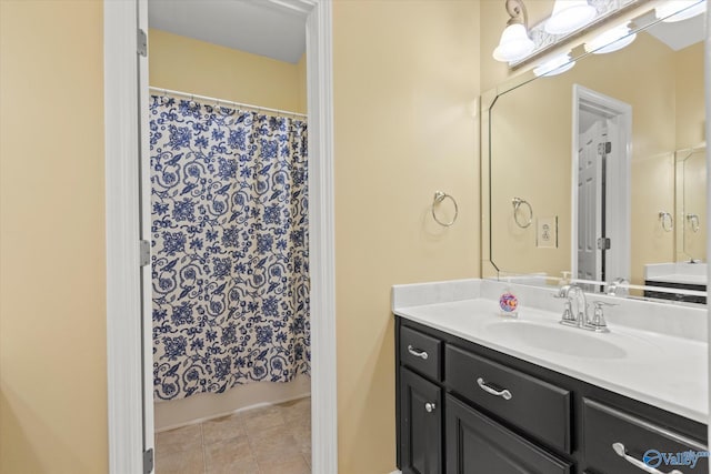 full bathroom with tile patterned floors, vanity, and a shower with curtain