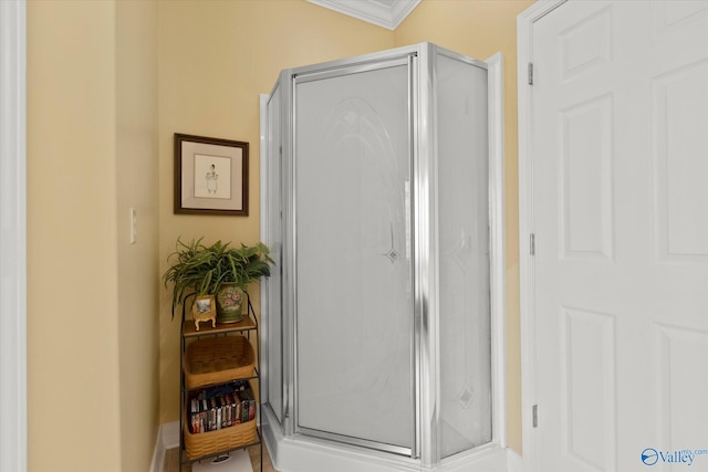 doorway to outside featuring crown molding and baseboards