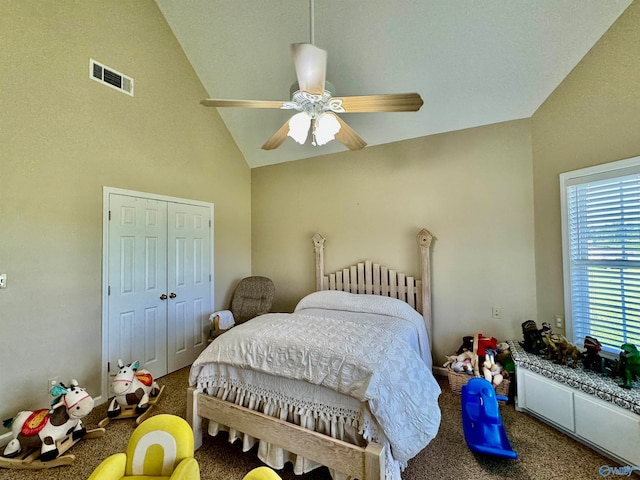 bedroom with carpet flooring, a closet, ceiling fan, and high vaulted ceiling