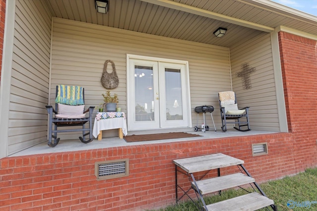 view of patio with french doors and visible vents
