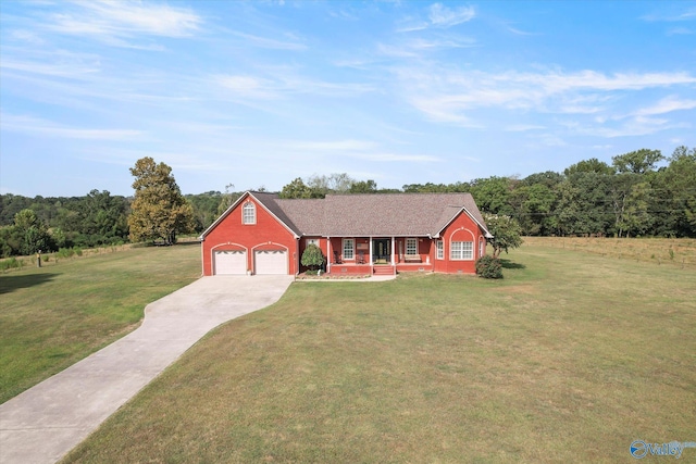 view of front of home with an attached garage, driveway, a front lawn, and covered porch