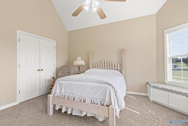 carpeted bedroom with lofted ceiling, a closet, ceiling fan, and radiator