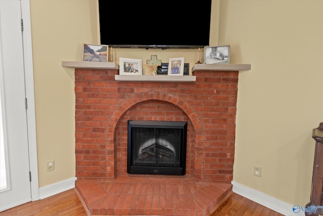 details featuring baseboards and wood finished floors