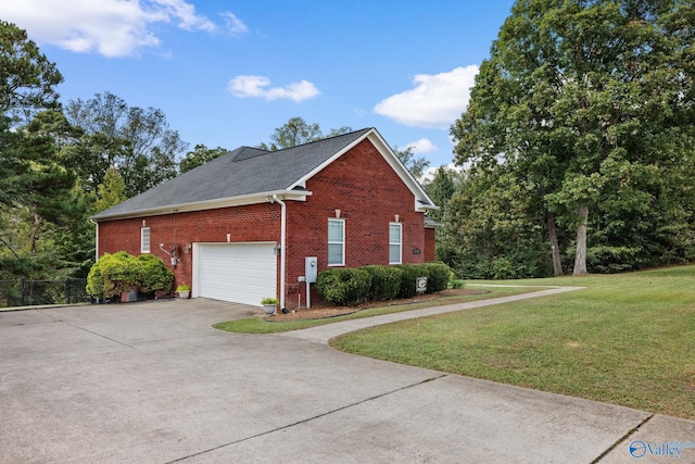 view of home's exterior featuring a yard and a garage