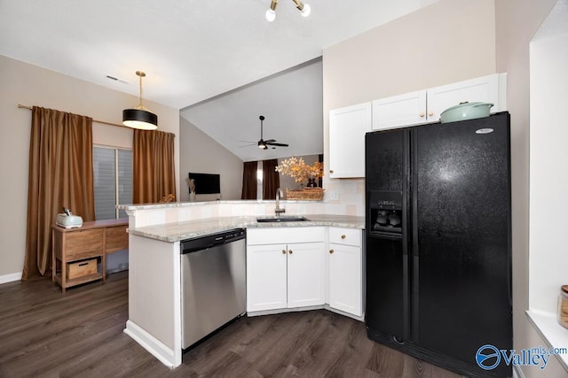 kitchen featuring a peninsula, a sink, white cabinetry, black fridge, and dishwasher