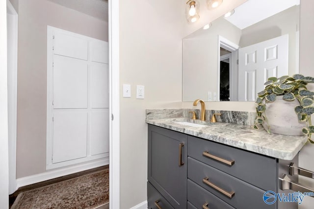 bathroom featuring vanity and baseboards