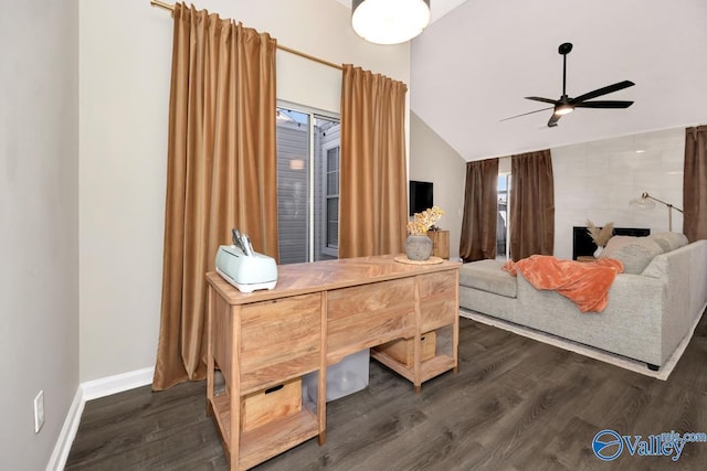 bedroom with baseboards, vaulted ceiling, and dark wood-type flooring