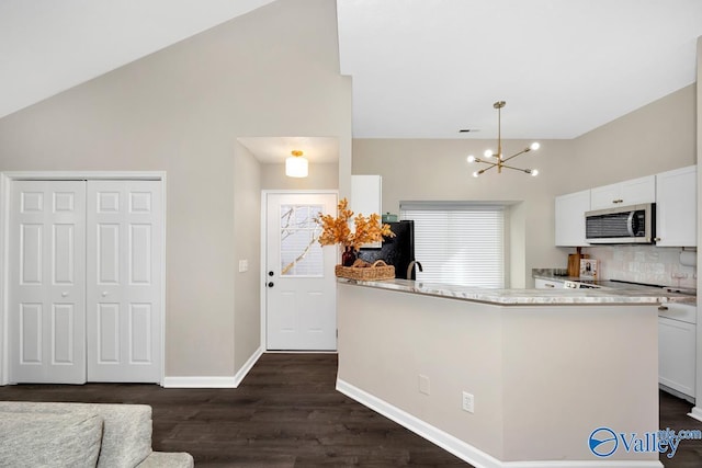 kitchen featuring white cabinets, stainless steel microwave, dark wood finished floors, and visible vents