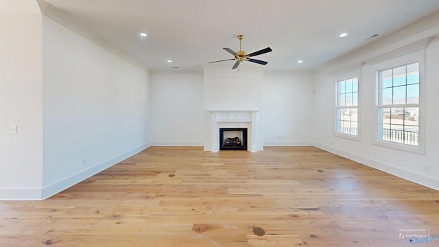 unfurnished living room featuring recessed lighting, a fireplace, light wood-style floors, ceiling fan, and baseboards