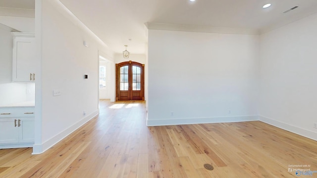 foyer entrance with recessed lighting, visible vents, light wood-style flooring, baseboards, and french doors