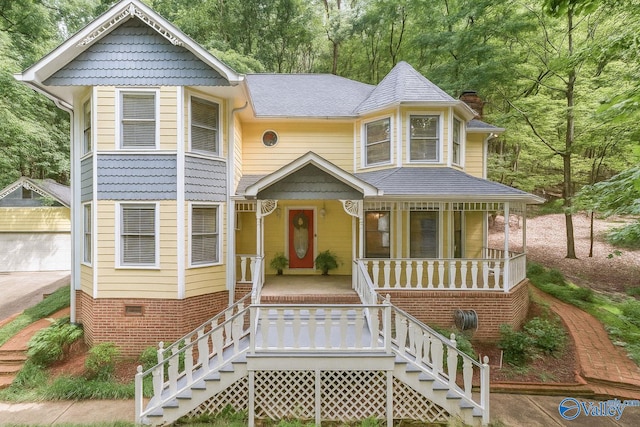 7925 Smoke Rise Rd SE, Huntsville, AL 35802 - victorian house featuring covered porch, stairway, a chimney, and roof with shingles