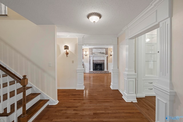 7925 Smoke Rise Rd SE, Huntsville, AL 35802 - corridor featuring wood finished floors, a textured ceiling, and stairway