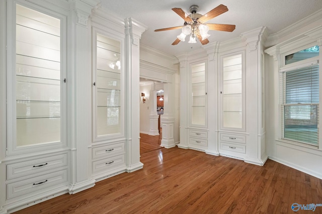 7925 Smoke Rise Rd SE, Huntsville, AL 35802 - unfurnished bedroom with ornamental molding, wood finished floors, and ceiling fan