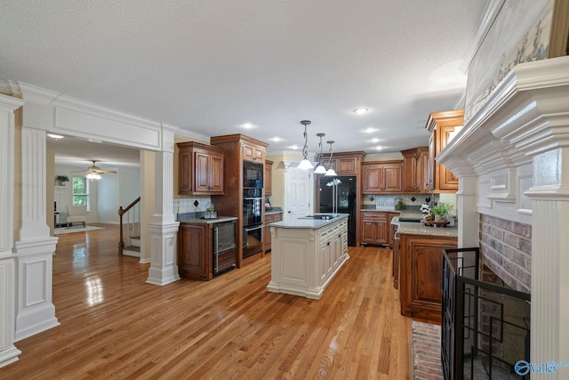 7925 Smoke Rise Rd SE, Huntsville, AL 35802 - kitchen featuring tasteful backsplash, light wood finished floors, wine cooler, brown cabinetry, and crown molding