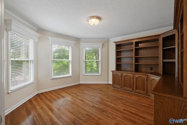 7925 Smoke Rise Rd SE, Huntsville, AL 35802 - empty room with crown molding, a textured ceiling, and light wood-style flooring