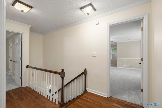 7925 Smoke Rise Rd SE, Huntsville, AL 35802 - hall featuring an upstairs landing, wood finished floors, crown molding, and a textured ceiling