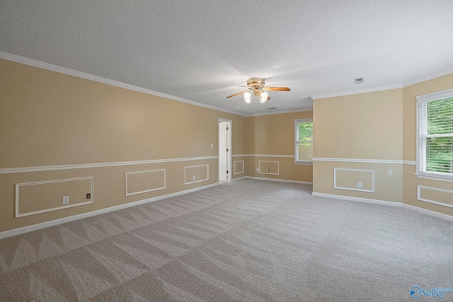 7925 Smoke Rise Rd SE, Huntsville, AL 35802 - unfurnished room with ceiling fan, a textured ceiling, crown molding, carpet flooring, and wainscoting