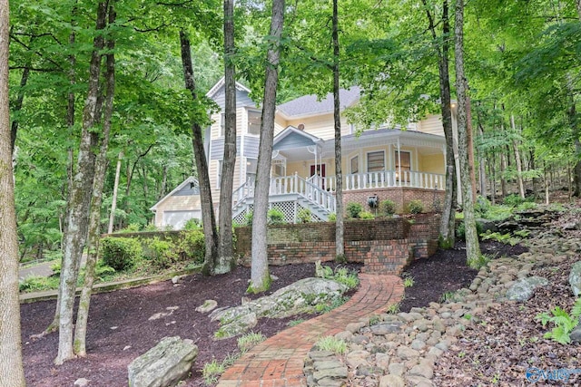 7925 Smoke Rise Rd SE, Huntsville, AL 35802 - view of front of home featuring a porch, stairway, and a garage