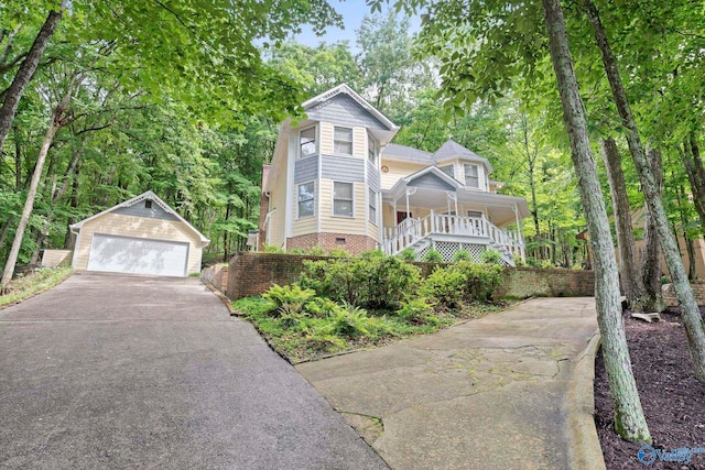 7925 Smoke Rise Rd SE, Huntsville, AL 35802 - victorian home featuring an outbuilding, a porch, a detached garage, stairway, and crawl space