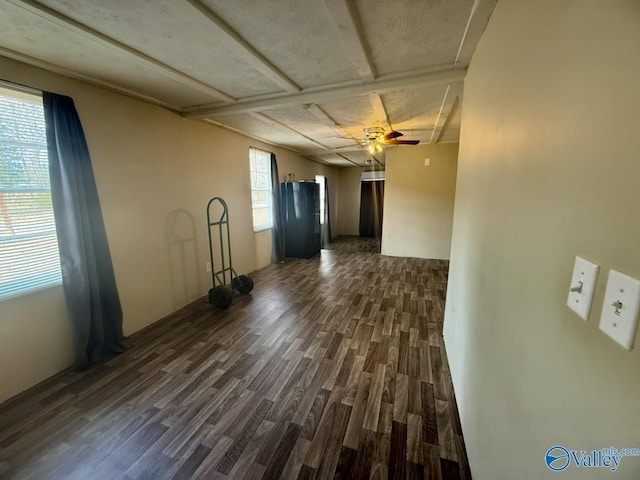 unfurnished room featuring ceiling fan and dark hardwood / wood-style flooring