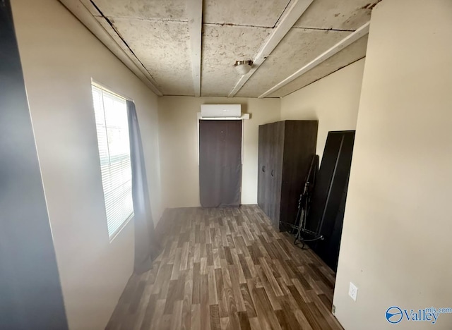 hallway with wood-type flooring