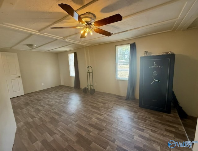 spare room featuring ceiling fan and dark hardwood / wood-style flooring