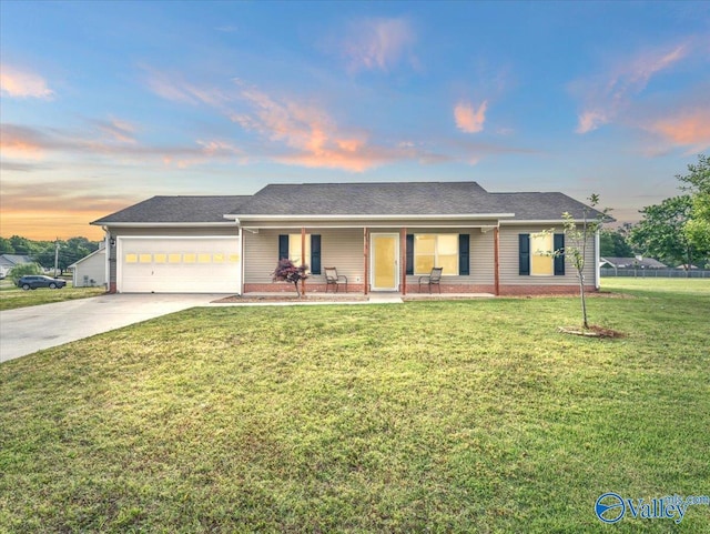 323 Earnhardt Dr, New Market, AL 35761 - single story home with concrete driveway, an attached garage, a front yard, and a porch