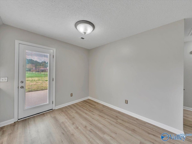 323 Earnhardt Dr, New Market, AL 35761 - spare room with wood finished floors, baseboards, and a textured ceiling
