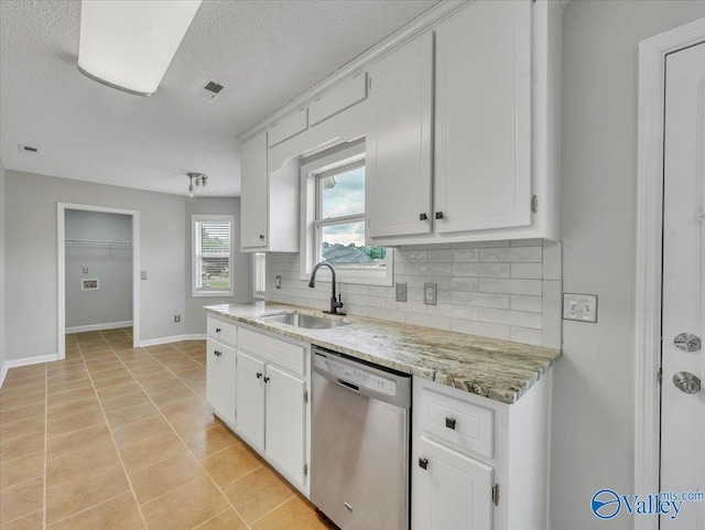 323 Earnhardt Dr, New Market, AL 35761 - kitchen with dishwasher, a sink, decorative backsplash, baseboards, and white cabinetry